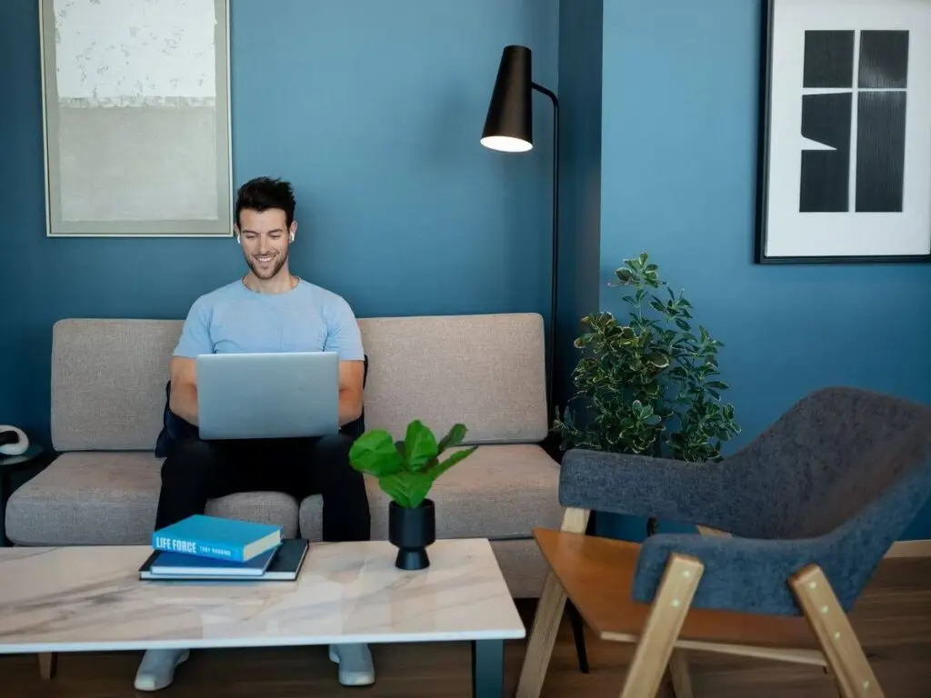 Resident working from the top-floor coworking lounge
